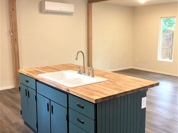 Kitchen island with vintage cast iron porcelain sink.