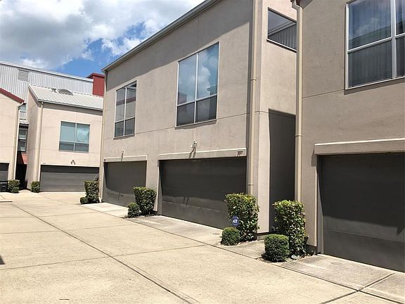 Walking up to the entrance of your new home with a two car garage