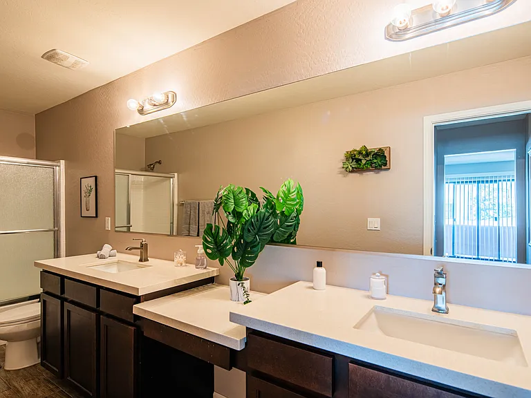 Master bathroom with large double vanity sinks and large mirrors