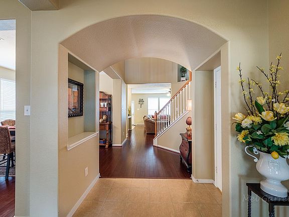 Open entry way with bamboo, hardwood floors is very welcoming to all who enter.