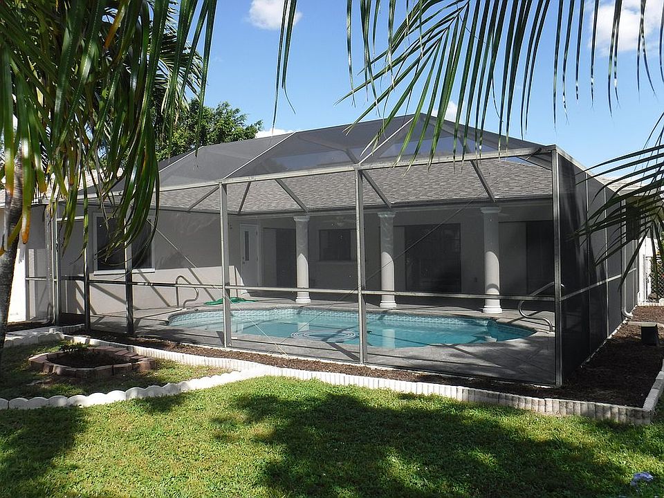 In-ground pool under screen