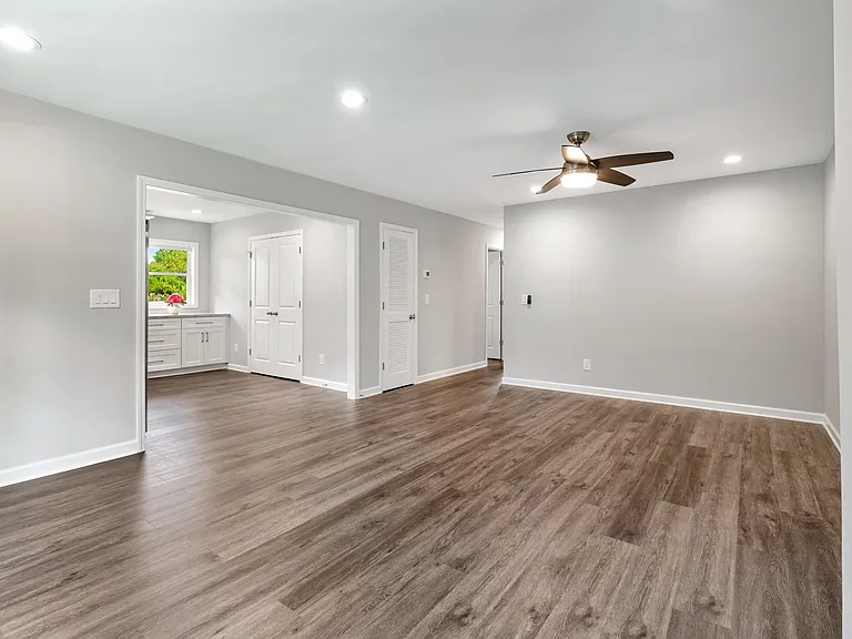 Open-concept living area seamlessly flows into a modern chef's kitchen.