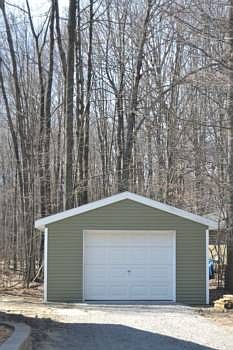 Off to one side of the home is an additional garage that measures 24x16. The exterior matches the ho