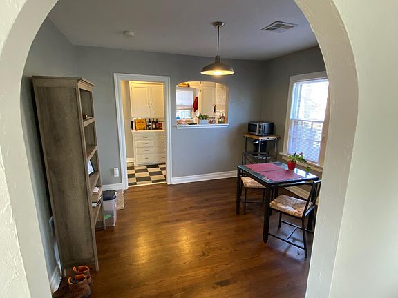 Arch door way to dining and kitchen