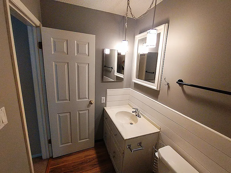 Bathroom with updated lighting and updated flooriing