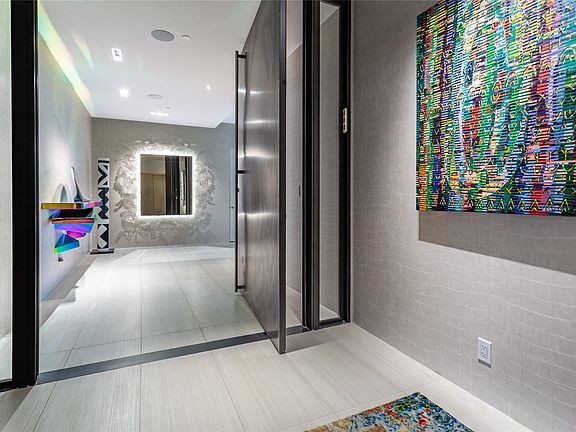 Private Elevator Entry opens to a gracious Foyer.