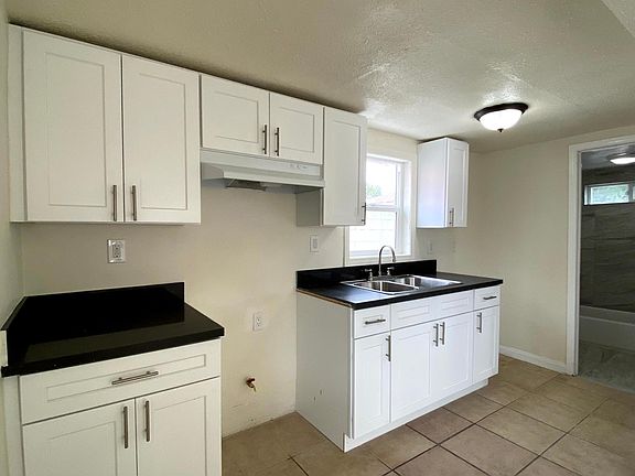 kitchen with door to bathroom