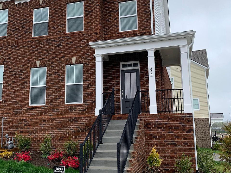 Gorgeous end unit townhome in Burkitt Ridge with front porch overlooking the hills of TN. House is at the corner of Ben Hill Rd and Tasker Dr