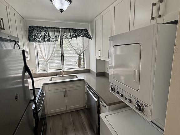 Kitchen: dishwasher, stackable washer and dryer