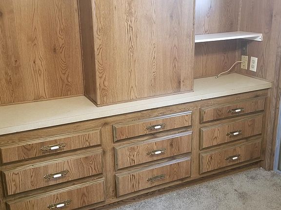 Bedroom has built in drawers, mirrored closet.
