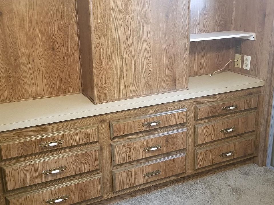 Bedroom has built in drawers, mirrored closet.