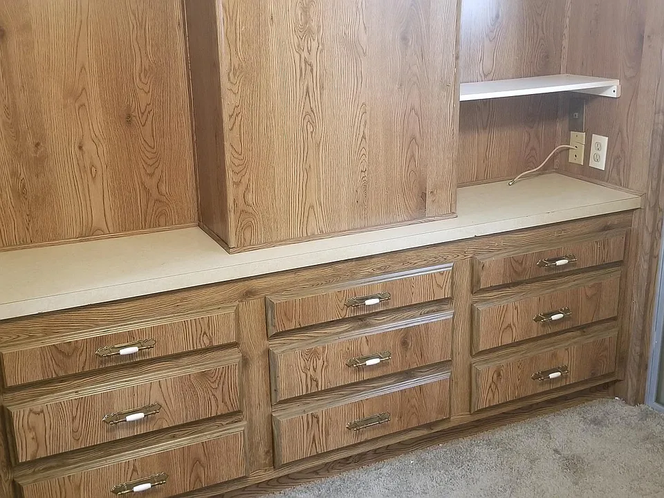 Bedroom has built in drawers, mirrored closet.