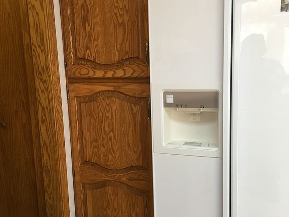 Pantry next to fridge