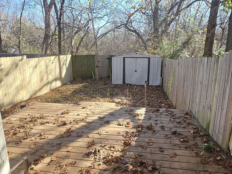 Back patio small covered sitting area and large deck.
