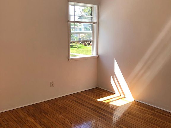 Bedroom flooring and window to outside garden area