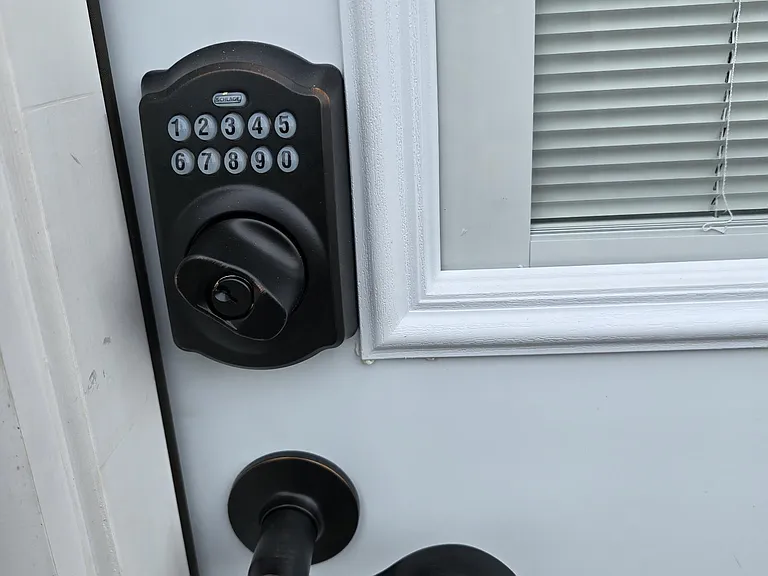 Side entrance door has Schlage keypad lock (all doors keyed off one key) for easy but secured access. [photo take prior to painting door]