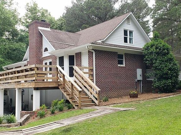 Back of house and (L) side yard