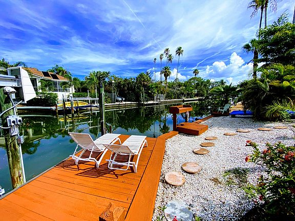 Waterfront home on canal with private dock and boatlift.