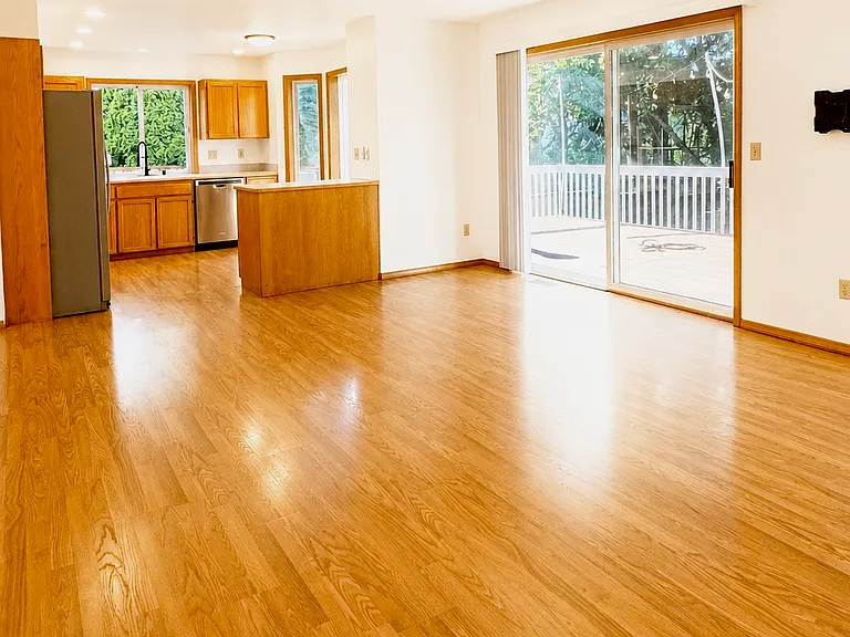 Family Room Attached to Kitchen Leading to Back Deck & Yard
