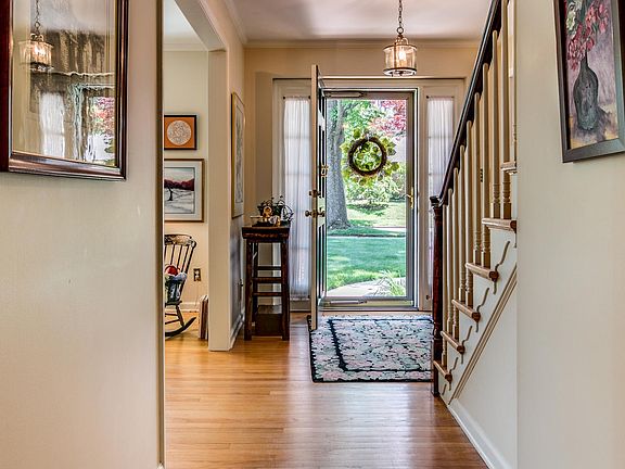 Sunny foyer with hardwood floors