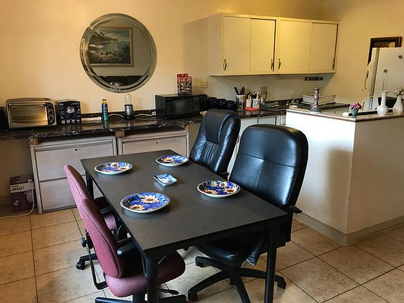Kitchen stocked with appliances / dinnerware
