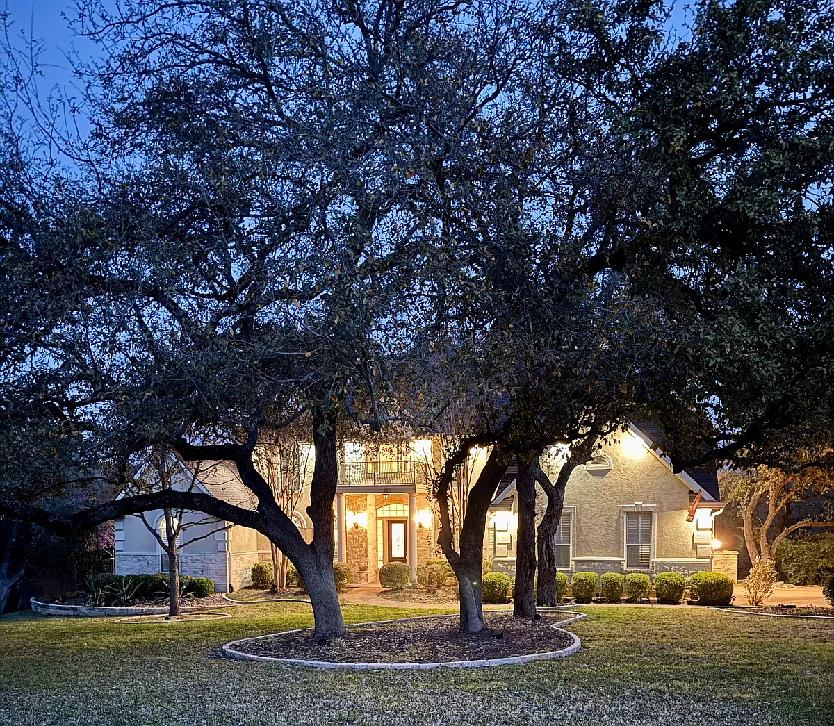 evening shot of front with yard - 2815 Demona Dr
