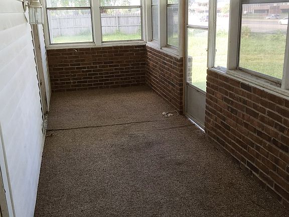 screened in front porch {turf flooring}