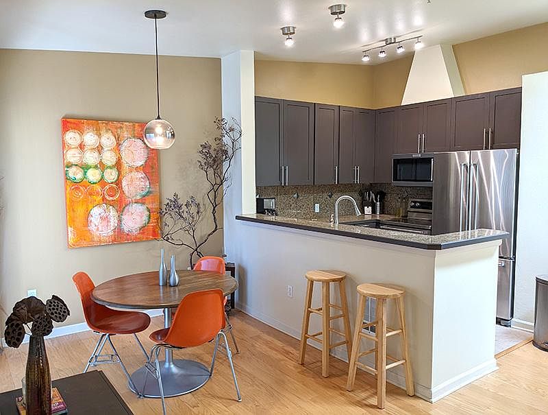 Dining room with sliding glass doors and newly upgraded kitchen