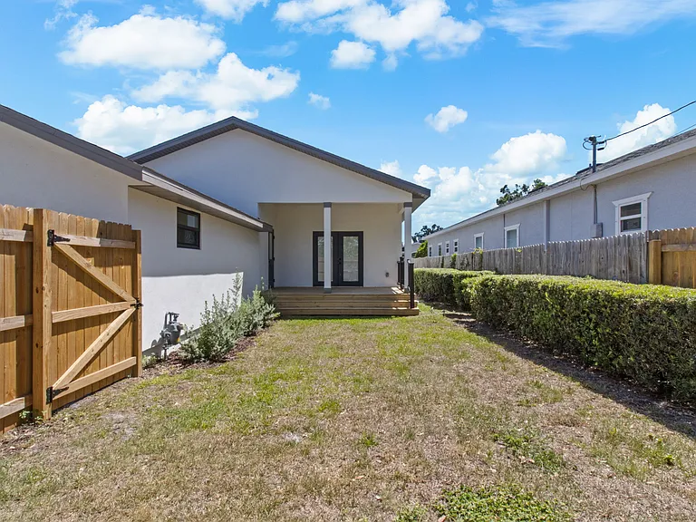 Fenced back yard and back porch