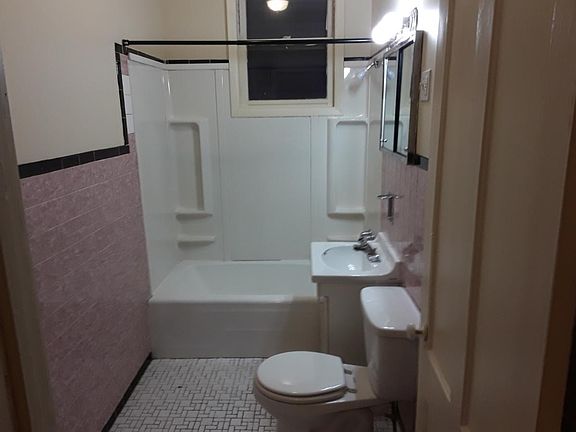 Full bathroom with shower surround