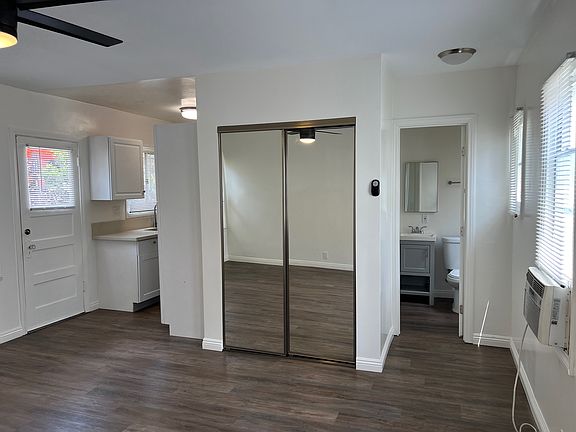 Living Room with view of closet and bathroom