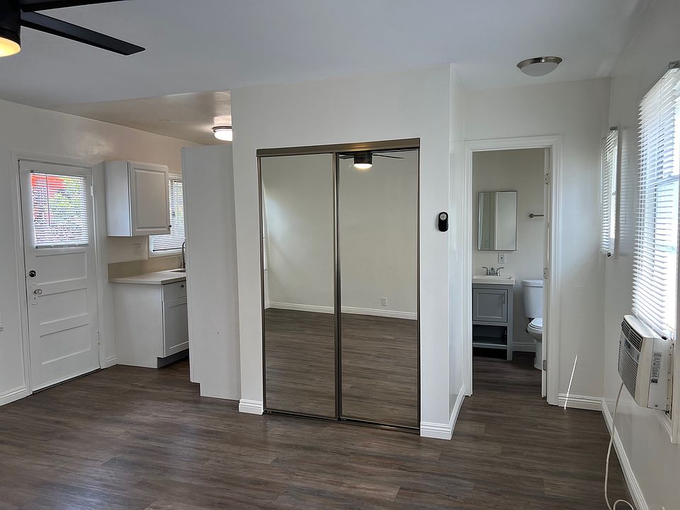 Living Room with view of closet and bathroom