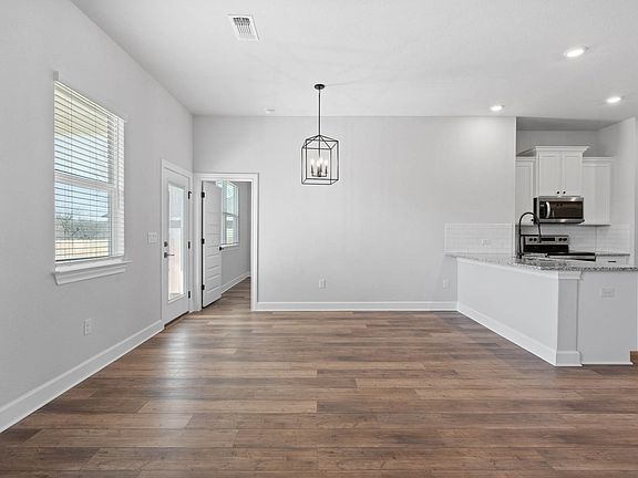The dining room sits right off of the kitchen.