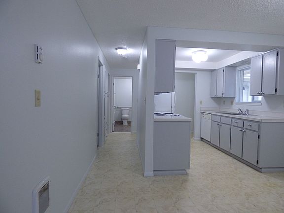 Kitchen looking from the dining room down hallway