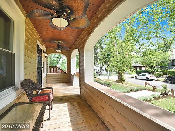 Relax on this covered front porch w/2 paddle fans
