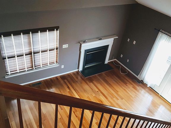 View of living room from upstairs, hardwood floors