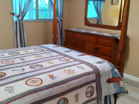 Guest bedroom decorated in a lighthouse theme