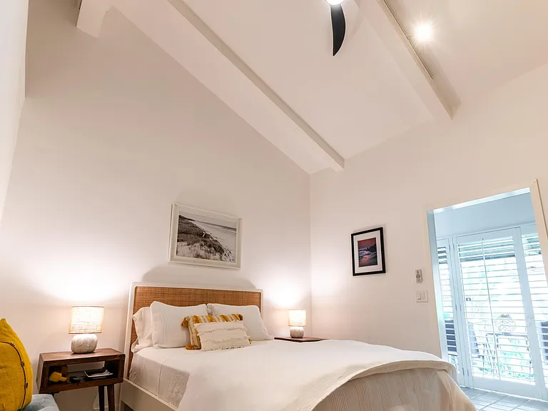 Master bedroom with vaulted ceilings. Includes Lutron switch to operate ceiling fan and lighting.