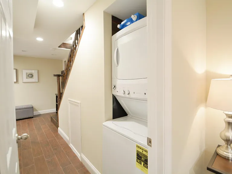 Laundry. Hallway in lower living area.