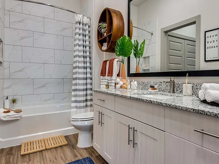 Griffis Frisco apartment bathroom with quartz countertops.