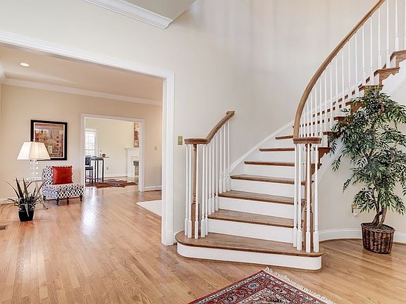 Welcoming Entry Foyer with Circular Stairwell