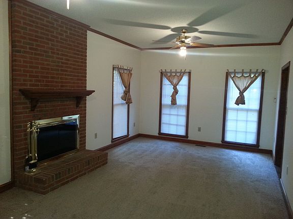 large living/family room combo with wood burning fireplace