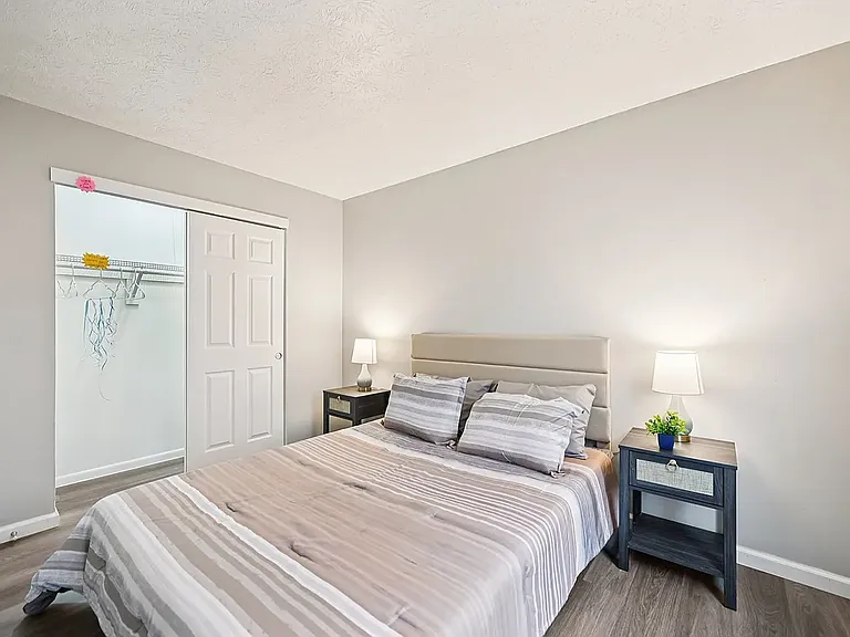 master bedroom with wall to wall closet