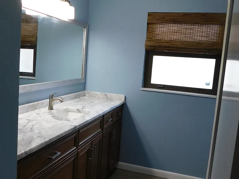 Here's the middle bathroom, looking southward. The shower/tub is on the right with the toilet just beyond it.