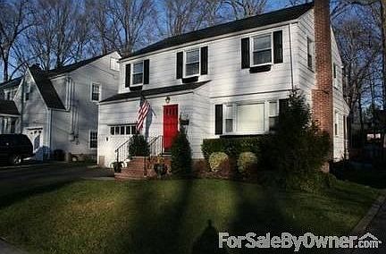 Front of House : Beautifully maintained colonial on tree-lined, sidewalked street.