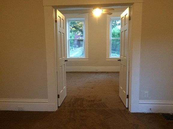 Entry from living room into front bedroom