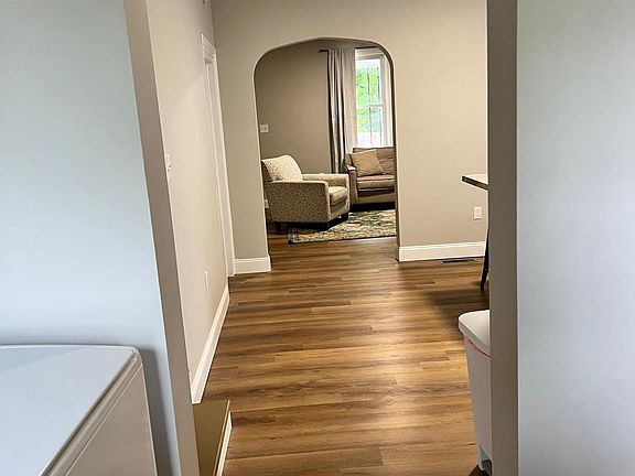 view from back door entrance, laundry room, kitchen, and living room