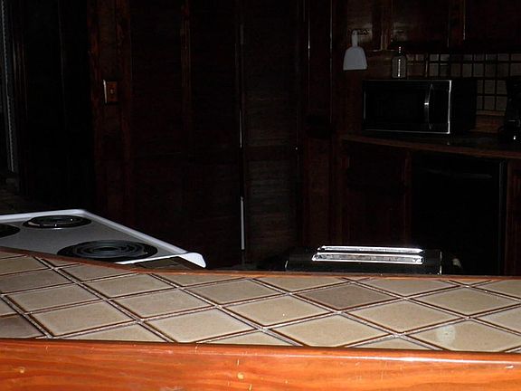 Nice tile work on wrap around bar divider