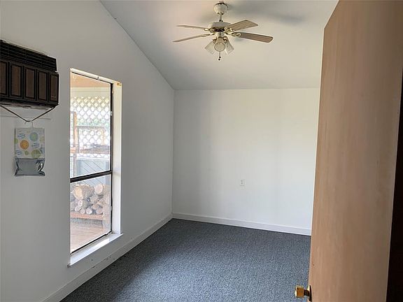 Photo showing one of the two bedrooms, notice the tall ceilings. Both bedrooms have direct views of the lake. You will really appreciate all the storage it has to offer.