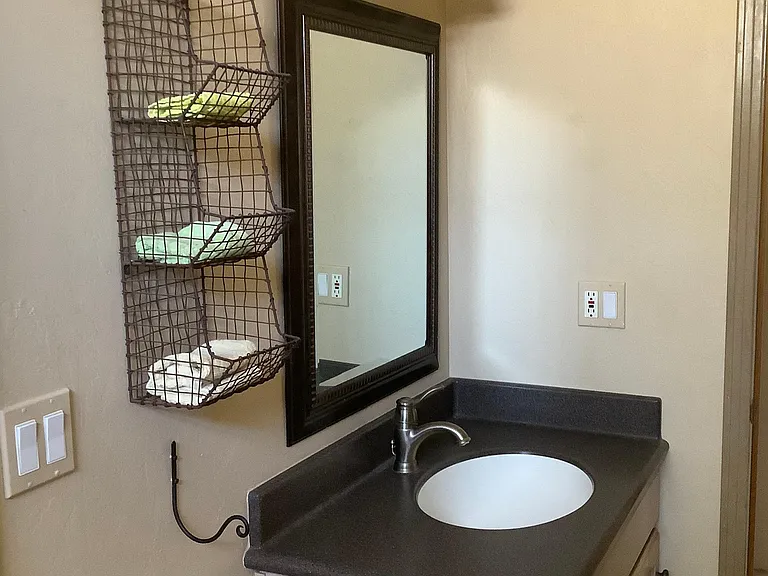 Second full bathroom , off of bedroom, has tub and tile floor.